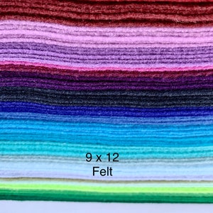 May include: A stack of 9x12 inch felt sheets in various colors, including red, purple, blue, green, and white. The text "9 x 12 Felt" is printed on the stack.