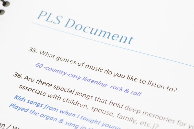 May include: A page from a document titled "PLS Document" with two questions. Question 35 asks "What genres of music do you like to listen to?" and lists "country-easy listening-rock & roll". Question 36 asks "Are there special songs that hold deep memories for you associate with children, spouse, family, etc.?"
