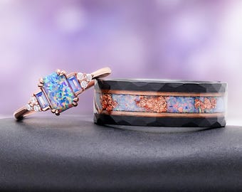 May include: A rose gold ring featuring a rectangular blue opal center stone, baguette-cut side stones, and small round accent diamonds, paired with a wide black hammered metal band inlaid with a central strip of blue opal and copper flakes.