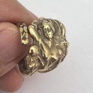 May include: A rustic, wooden serving tray with a dark stain. The tray features two metal handles and a rectangular shape. The dimensions are approximately 18 inches long and 12 inches wide.