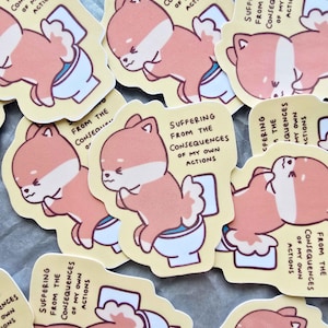 May include: A collection of stickers featuring a cartoon Shiba Inu on a toilet. The dog is peach and white, with the text "Suffering from the Consequences of My Own Actions" on each sticker. The stickers have a yellow background.