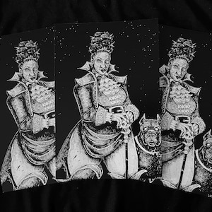 May include: A black and white art print featuring a central figure with an elaborate updo hairstyle, wearing a high-collared jacket with a ruffled jabot, holding a cane topped with a skull, and accompanied by two dogs against a starry background.