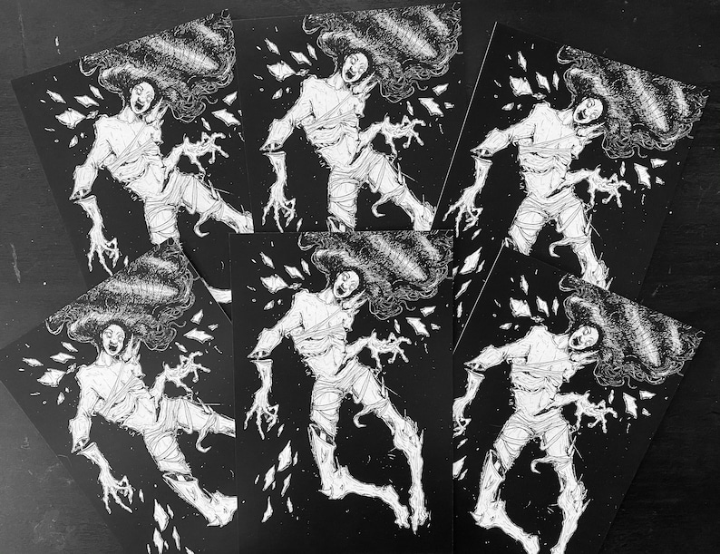 May include: A collection of five identical rectangular art prints featuring a high-contrast black and white illustration of a figure with long flowing hair, wrapped in bandages, and surrounded by floating shards against a solid black background.
