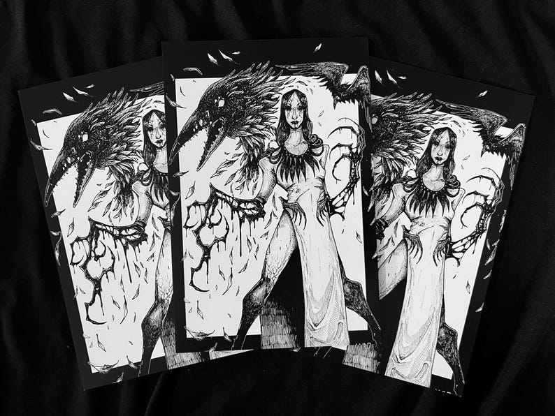 May include: A black and white ink illustration print featuring a central figure in a long dress with clawed hands and a large raven perched on their shoulder. The artwork is detailed with feathers, dark textures, and a stark contrast between light and shadow.