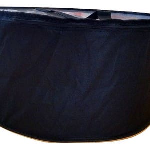 May include: A black cylindrical laundry hamper with a zipper closure and a drawstring top.