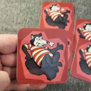 May include: Square red cards featuring a cartoon husky in a red and white striped shirt, black fur, and a relaxed pose. The husky is smoking and has a smug expression. Several cards are visible.