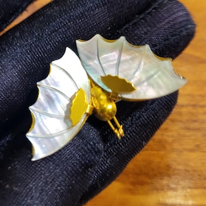 Vintage gold tone butterfly brooch with mother of pearl wings