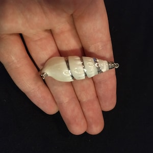 Vintage spiral cone shape white shell pendant with metallic silver accents