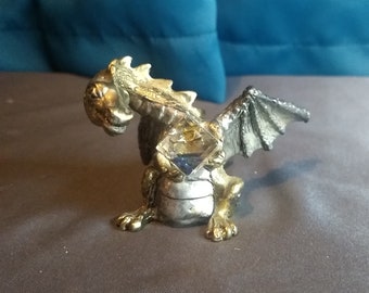 Pewter dragon holding a cube crystal figurine