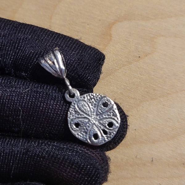 Small sterling silver sand dollar pendant or charm, vintage jewelry
