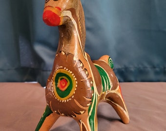 Vintage Mexican terra cotta horse piggy bank with floral designs in red, green, white and brown