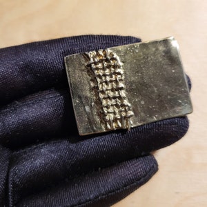 Flat rectangular silver-tone brooch with tire treads or stitches, abstract brutalist brooch, vintage jewelry