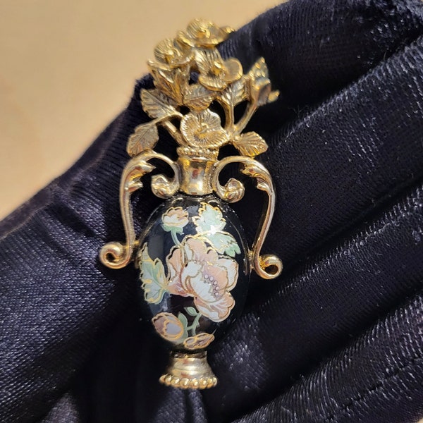 Gold tone metal ornate vase with flowers brooch, vintage brooch