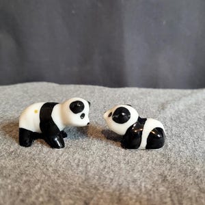 Tiny black and white porcelain pandas with sleepy faces figurines set of 2