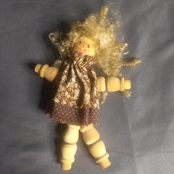 Handmade vintage wooden spool doll, folk art, girl with curly blonde hair and brown dress