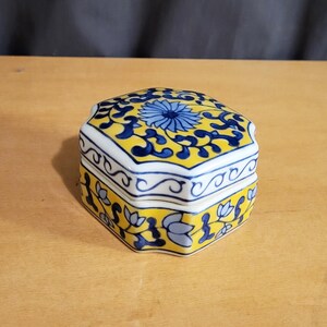 Vintage blue and yellow octagonal porcelain trinket jewelry box with floral design