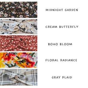 May include: Five fabric headbands with various patterns. The top headband is black with a floral design, labelled "Midnight Garden." The second is cream with butterfly designs, labelled "Cream Butterfly." The third is rust-coloured with a floral pattern, labelled "Boho Bloom."