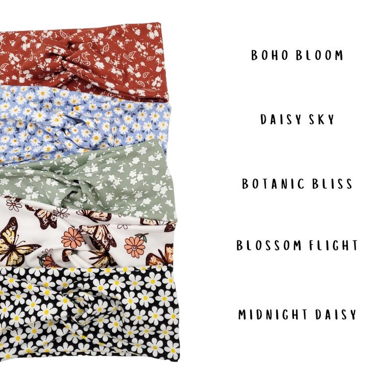 May include: Five knotted headbands with various patterns: Boho Bloom in rust with white florals, Daisy Sky in light blue with white daisies, Botanic Bliss in sage green with white florals, Blossom Flight with butterflies, and Midnight Daisy in black.