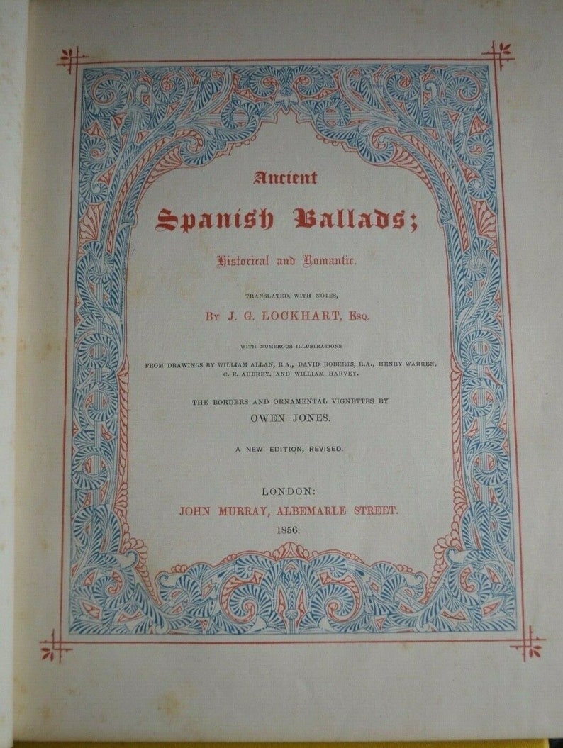 May include: A book cover titled "Ancient Spanish Ballads; Historical and Romantic." The cover features ornate blue and red decorative borders. The text includes the author's name, J.G. Lockhart, Esq., and the publisher, John Murray, Albemarle Street, London, 1856.