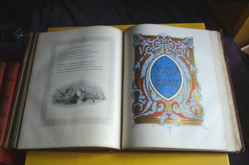 May include: Open antique book with ornate illustrations. The left page features a poem with a small black and white drawing of ships. The right page has a blue oval with the words "Moorish Ballads" in gold lettering, surrounded by red and gold designs.