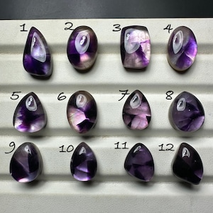 trapiche amethyst cabochon backed with mother of pearl