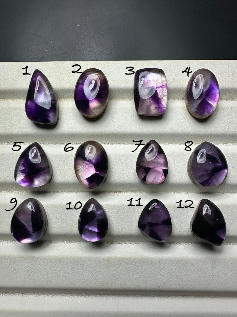 trapiche amethyst cabochon backed with mother of pearl
