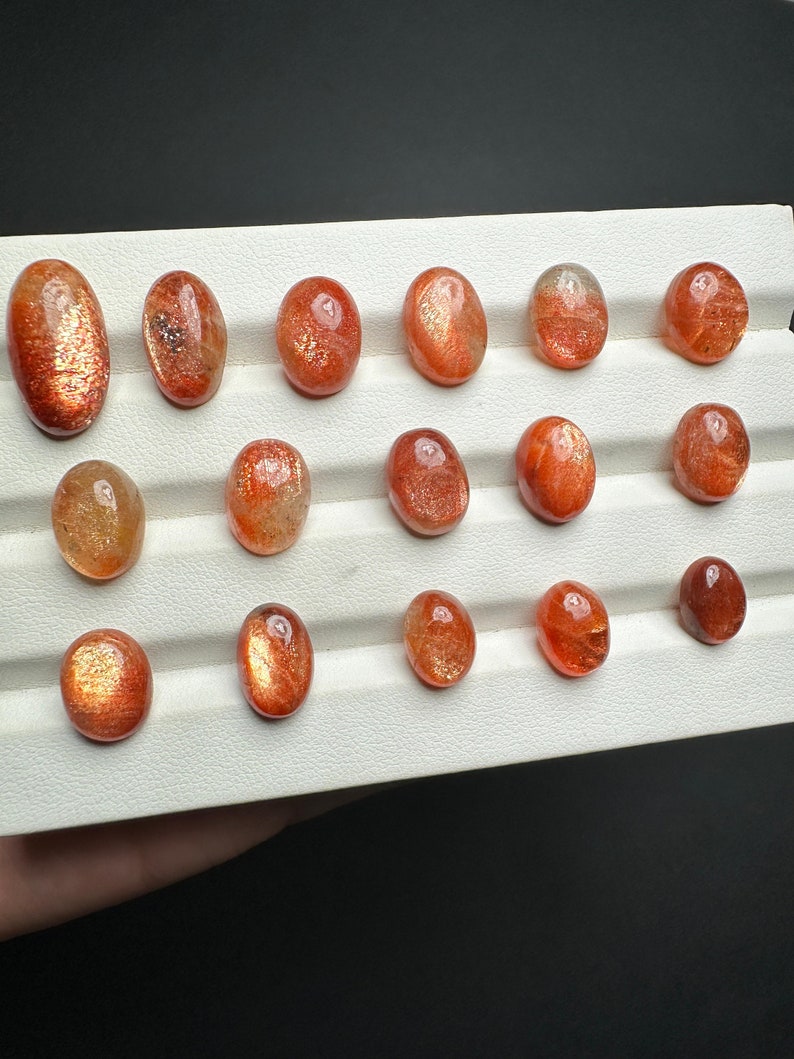 orange sunstone cabochon with golden fire