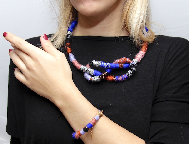 Adjustable lengths acrylic wool and cotton are braided and knotted Set Necklace and bracalet Gold-colored closures. Wool