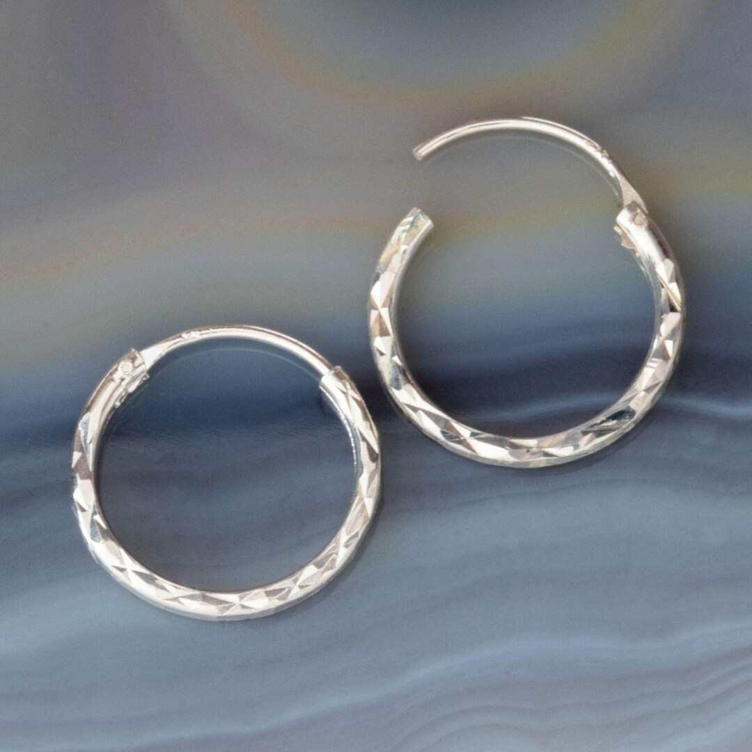 thumbnail interactive-video image 1 of 925 Sterling Silver Plated Big Hoop Earrings – 50mm Diamond Cut – Includes Gift Bag 1 of 2