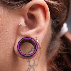 Black Silicone Ear Tunnel "Hollow Eye" with purple ring inlay Flexible Ear Plugs