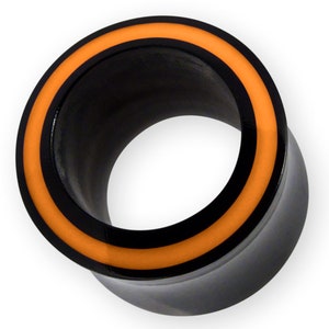 May include: Black ear gauge with an orange and black ring around the edge.