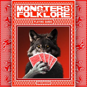 May include: A deck of "Monsters of Folklore" playing cards. The card box is red with white text and a white border. The image on the box features a wolf holding red playing cards. The text "PLAYING CARDS" is also visible.
