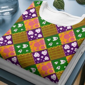Mockup of a t-shirt showing the all-over print of the patchwork skulls seamless design, ideal for sublimation or DTG printing.