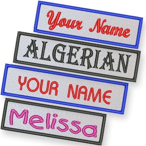May include: Four white fabric patches with embroidered text. The top patch has blue edging and says "Your Name" in red cursive. The second patch says "ALGERIAN" in black. The third patch has blue edging and says "YOUR NAME" in red. The bottom patch says "Melissa" in pink cursive.