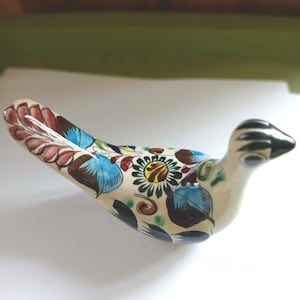 May include: A set of three ceramic canisters with lids. The canisters are white with a textured, ribbed design. The lids are made of wood. The canisters are of varying sizes, suitable for kitchen storage.