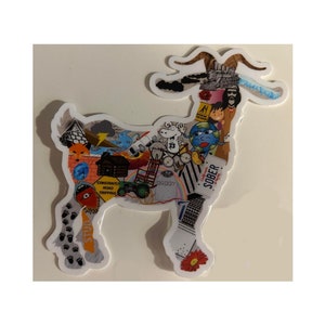 May include: A white sticker with a colorful collage of images in the shape of a goat. The goat is standing on all four legs and has a long, curved neck. The collage includes images of a globe, a cloud, a lightning bolt, a house, a clock, a flower, and the word "SOBER."
