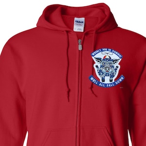 May include: A red zip-up hoodie with a hood and front pockets. The hoodie features a graphic on the chest with a pig illustration and the text "Whirly Pig is Coming! Well All Fall Down."