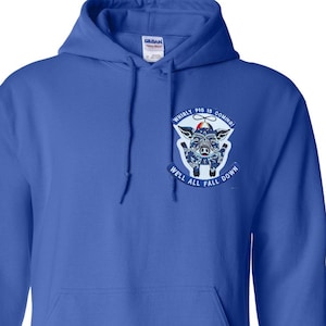 May include: Royal blue hooded sweatshirt with a front pocket and drawstring. The sweatshirt features a graphic of a pig with the text "Whirly Pig Is Coming! Well All Fall Down."