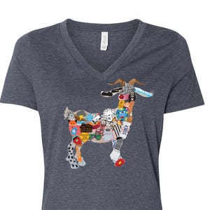 May include: Dark gray v-neck t-shirt featuring a goat design composed of various colorful images. The goat graphic includes images of sports equipment, flowers, and other small illustrations. The shirt is made of a soft material.