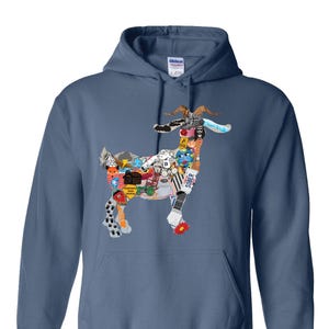 May include: A blue hooded sweatshirt featuring a goat design composed of various colorful images. The goat's body is made up of a collage of cartoon characters, objects, and text. The sweatshirt has a front pocket and a drawstring hood.