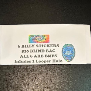 May include: A white paper envelope with text and two colorful stickers. The text reads "6 BILLY STICKERS $10 BLIND BAG ALL 6 ARE BMFS Includes 1 Looper Holo". The stickers are a rainbow rectangle and a badge.