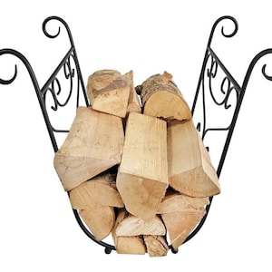 May include: A black wrought iron log basket filled with split firewood. The basket has a curved design with decorative scrollwork and handles. The firewood is light brown and neatly stacked inside.