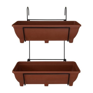 May include: A black metal plant stand with two terracotta-coloured planters. The stand is designed to hang from a wall or ceiling.