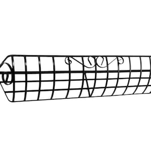 May include: Black metal window box with a decorative scroll design. The box is designed to be mounted on a wall.
