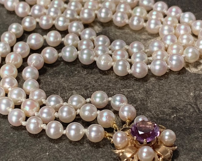 3 strand pearl necklace with a 9ct gold pearl and amethyst set clasp, 1988 London hallmarks