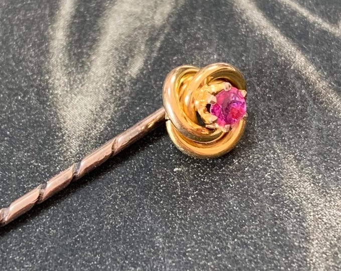 Natural ruby brooch pin. Edwardian 15ct Gold Antique Lovers knot with central ruby