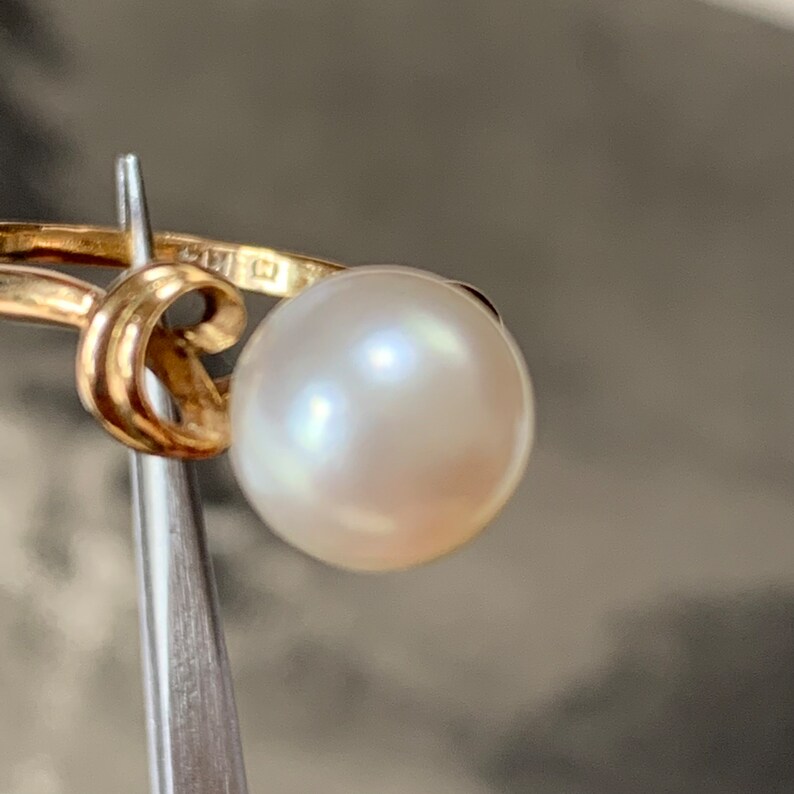 Mikimoto played a pivotal role in developing the modern pearl cultivation process, which involves carefully inserting a nucleus into an oyster and allowing it to naturally coat the nucleus with nacre