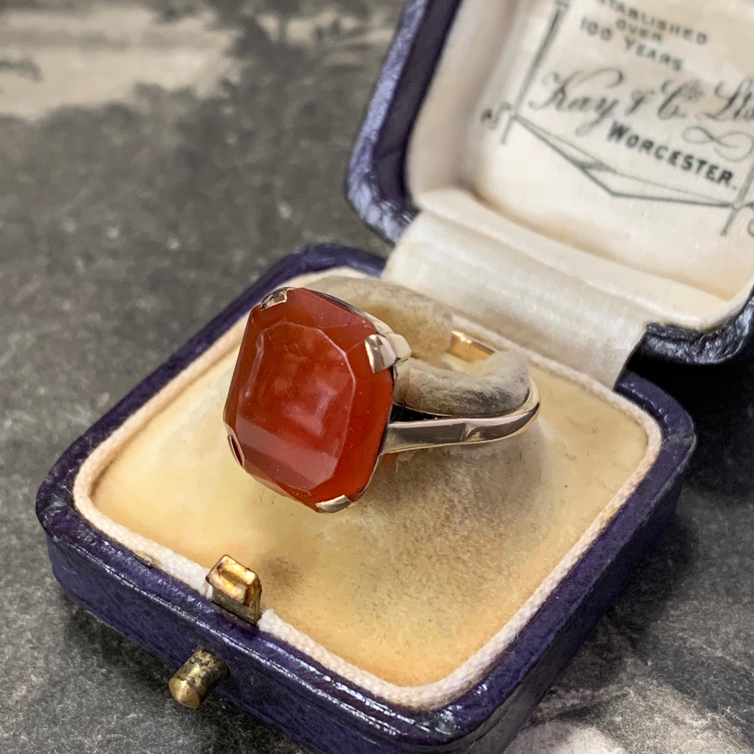 Exquisite Art Deco Carnelian Ring Is A True Gem. Crafted in 9Ct Yellow Gold, It Showcases Rectangular Bevel Cut Cabochon Stone