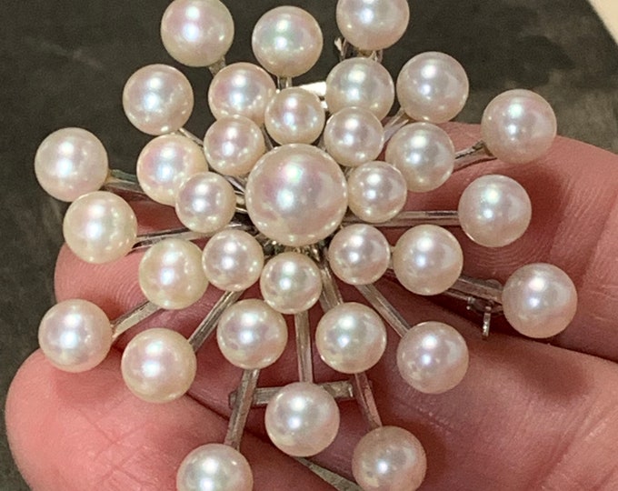 Akoya Pearl starburst brooch. 33 akoya pearls. 8mm-4mm graduated pearls set in Sterling silver. 23 grams weight