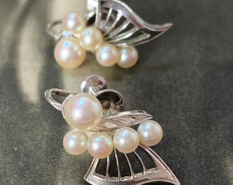 Mikimoto akoya pearl earrings. 4mm-6mm akoya pearls. Butterfly design in sterling silver with screw back fittings